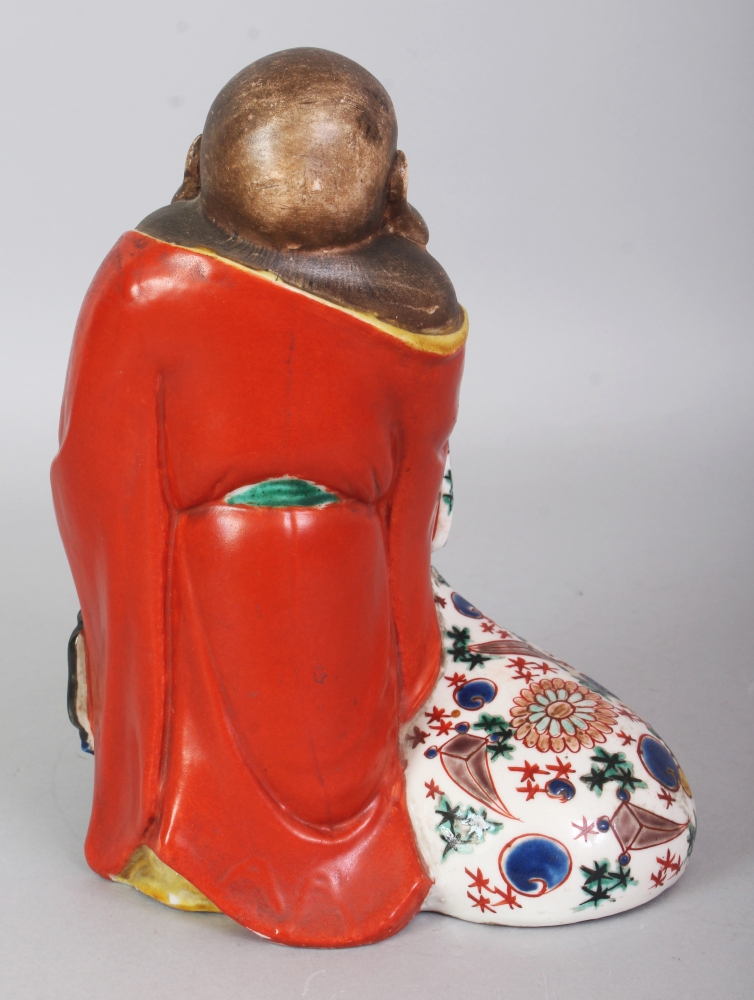 A JAPANESE MEIJI PERIOD KUTANI PORCELAIN FIGURE OF HOTEI, standing with a cheerful expression and - Image 3 of 7