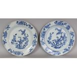 A PAIR OF EARLY 18TH CENTURY CHINESE KANGXI PERIOD BLUE & WHITE PORCELAIN PLATES, each painted