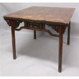 A 19TH CENTURY CHINESE SOFTWOOD SQUARE TABLE, with slightly flaring legs, the frieze centred on each