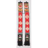 A PAIR OF CHINESE OR MONGOLIAN EMBROIDERED SASHES, each decorated with panels of buddhistic lions,