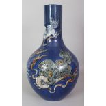 A LARGE 19TH CENTURY CHINESE POWDER-BLUE GROUND PORCELAIN BOTTLE VASE, the sides unusually decorated