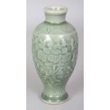 A SMALL 19TH CENTURY CHINESE CELADON PORCELAIN VASE, decorated beneath the glaze with scrolling