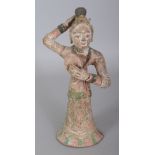 A TANG STYLE PIGMENT DECORATED CERAMIC FIGURE OF A DANCER, holding a mirror, 7.9in high.