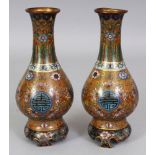 A PAIR OF GOOD QUALITY 19TH CENTURY CHINESE CLOISONNE VASES, each decorated with Shou medallions,