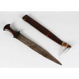 A BAOULE DAGGER with wooden handle in a leather sheath. 2ft long.