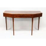 A GEORGIAN MAHOGANY OVAL TABLE with crossbanded top, cut off ends, on tapering legs. 4ft 2ins long.