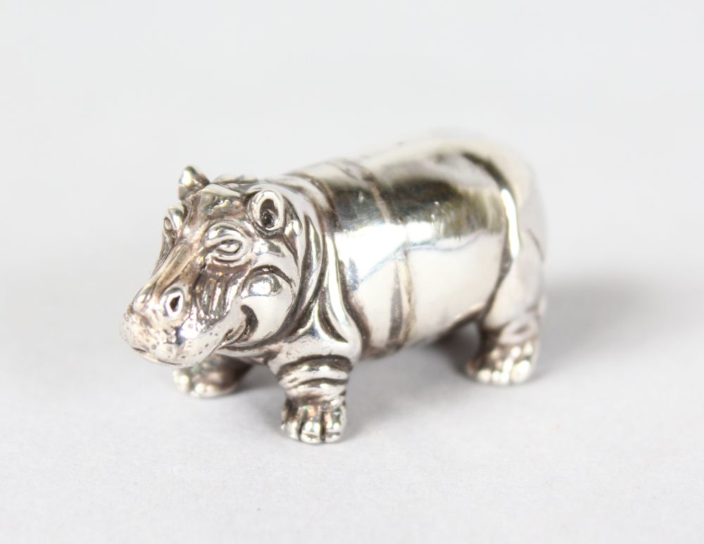 A SILVER MINIATURE HIPPO.