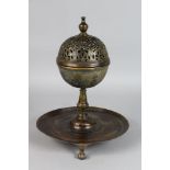 A 17TH CENTURY BRONZE PASTILLE BURNER with pierced top, engraved body, on a centre stem with