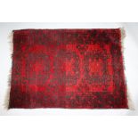 A BELOUCH RED GROUND RUG. 3ft x 2ft 3ins.