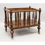 A GOOD VICTORIAN FIGURED WALNUT CANTERBURY, with three division top, turned rail supports, with