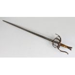 A 17TH CENTURY AND LATER BASKET HILT RAPIER, with part fullered tapering double edge blade, engraved