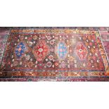 A LARGE PERSIAN CARPET with four major motifs, the border with gulls. 10ft 3ins x 5ft 9ins (some