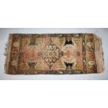 A SMALL PERSIAN RUG. 3ft 7ins x 1ft 8ins.