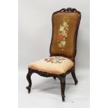 A VICTORIAN HIGH BACK NURSING CHAIR with floral needlework back and seat, supported on cabriole