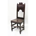 A 17TH CENTURY OAK SINGLE CHAIR with solid seat.