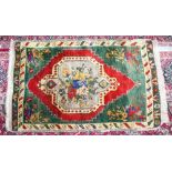 AN OLD SMALL PERSIAN RUG with central floral motif. 3ft 7ins x 2ft 2ins.