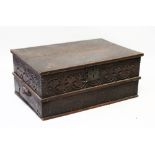 A 17TH CENTURY CARVED OAK BIBLE BOX with plain top with carved sides. 1ft 11ins wide.