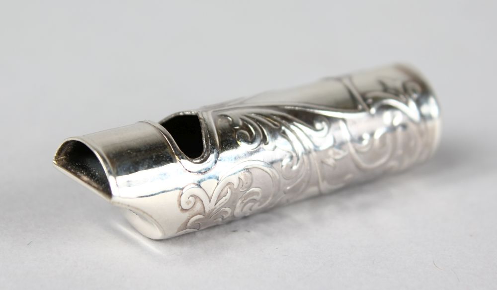 AN ENGRAVED SILVER WHISTLE.