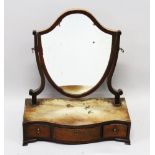 A GEORGIAN MAHOGANY SHIELD SHAPED TOILET MIRROR, the serpentine base with three drawers. 1ft 5ins