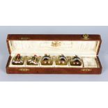 A SET OF FIVE AUSTRIAN TOTS with enamel decoration in a wooden box for six.