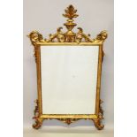 A GEORGIAN STYLE GILT UPRIGHT MIRROR with acanthus scroll and urn surmount. 4ft 2ins long x 2ft 2ins