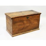 AN 18TH CENTURY COUNTRY MADE BOX of plain design, with lift up lid. 2ft long.