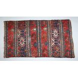 A SMALL PERSIAN RUG. 2ft 11ins x 1ft 8ins.