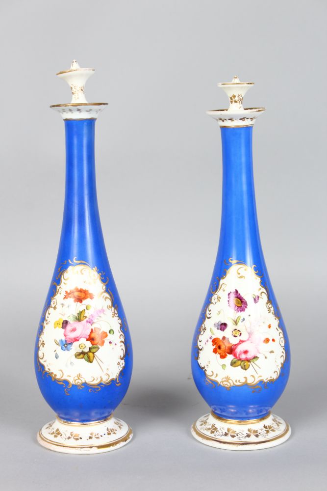 A PAIR OF JACOB PETIT BLUE WATER SPRINKLERS painted with a panel of flowers. 10.5ins high.