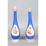 A PAIR OF JACOB PETIT BLUE WATER SPRINKLERS painted with a panel of flowers. 10.5ins high.