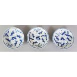 A GROUP OF THREE SIMILAR SMALL CHINESE KANGXI PERIOD BLUE & WHITE PORCELAIN FINGER DISHES, circa