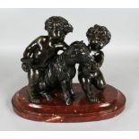 A SUPERB BRONZE GROUP OF TWO CUPIDS AND A GOAT on a marble base. 10.5ins high.