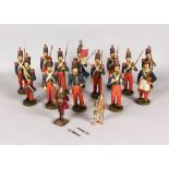 A RARE SET OF THIRTEEN CARVED AND PAINTED WOODEN PRUSSIAN SOLDIERS carrying arms, powder key and