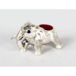 A MINIATURE SILVER ELEPHANT PIN CUSHION.