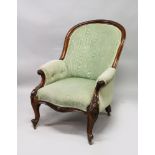 A VICTORIAN MAHOGANY FRAMED ARMCHAIR, with carved show wood frame, upholstered in green watered silk