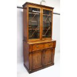 A GOOD EARLY 19TH CENTURY MAHOGANY SECRETAIRE BOOKCASE, the top with glazed astragal doors,