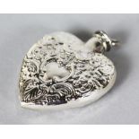 A MINIATURE SILVER EMBOSSED HEART SHAPED SCENT BOTTLE.