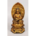 A LACQUER BUDDHA on a lotus throne. 11ins high.