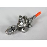 A SILVER AND CORAL BABIES RATTLE.