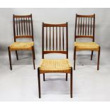 A SET OF EIGHT DANISH TEAK DINING CHAIRS, with plain top rails, spindle backs, rush upholstered