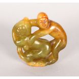 A CHINESE EROTIC JADE ROUNDEL.