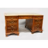 A GOOD GEORGE III DESIGN YEW PEDESTAL PARTNERS DESK, with green leather inset writing surface, an