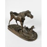 PIERRE JULES MENE (1810-1871) FRENCH. A FINE BRONZE STALLION saddle and armour at its feet. Signed