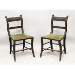 A PAIR OF REGENCY EBONISED SIDE CHAIRS, with upholstered seats and painted decoration.