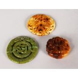 THREE CHINESE CARVED JADE ROUNDELS.