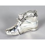 A MINIATURE SILVER BOOT AND CAT VESTA.