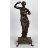 AFTER THE ANTIQUE A BRONZE "APHRODITE" standing on a rectangular base with four claw feet. 19ins