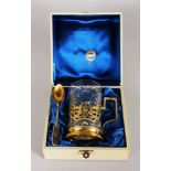 A SUPERB RUSSIAN SILVER AND NIELLO CUP AND SPOON, with cut glass liner, in original case.