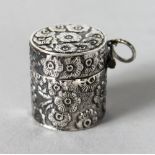 A SILVER EMBOSSED PILL BOX.