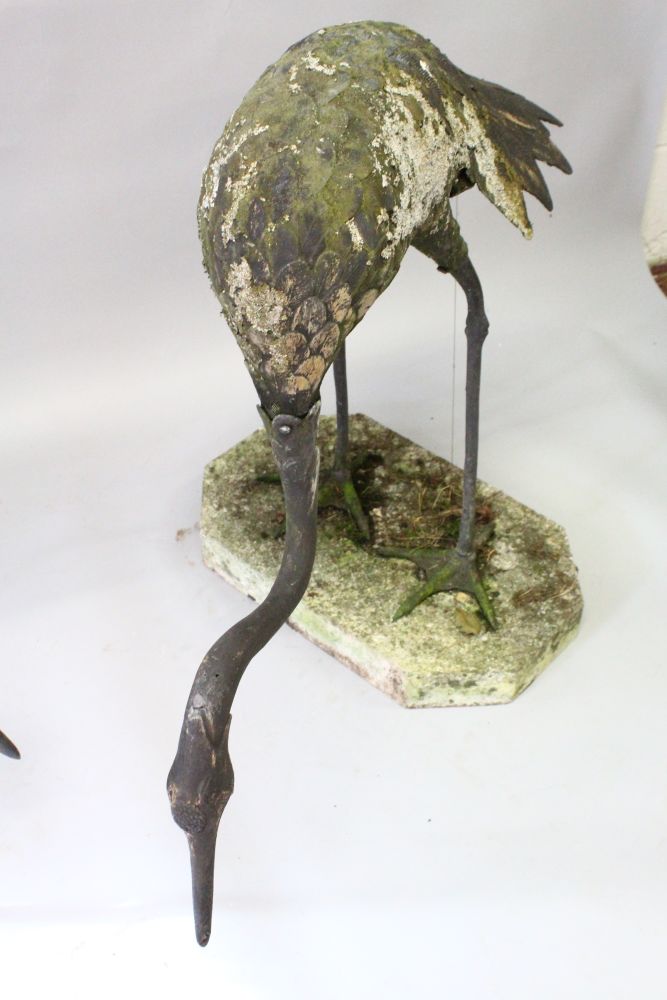 A GOOD PAIR OF JAPANESE LEAD MEIJI STYLE HERONS, on shaped reconstituted stone bases. 3ft 0ins - Image 4 of 4