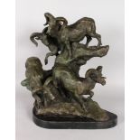 A GOOD BRONZE GROUP OF GOATS ON A ROCK, standing on a marble base. 16ins high.